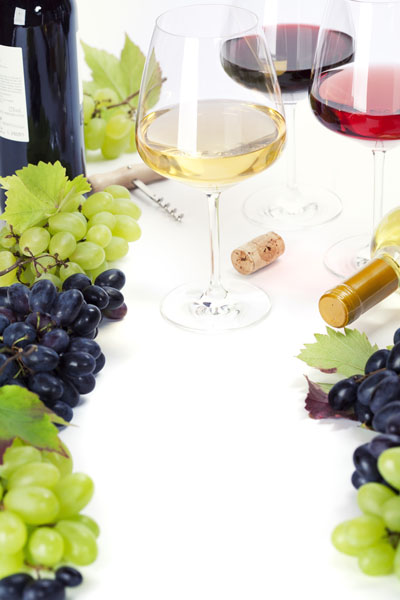 Glasses of white, red and rose wine and grapes